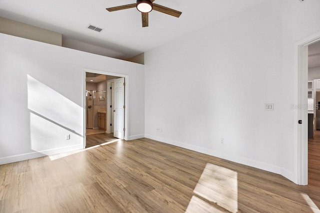 unfurnished room with hardwood / wood-style flooring and ceiling fan