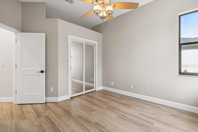 unfurnished bedroom featuring ceiling fan and light wood-type flooring