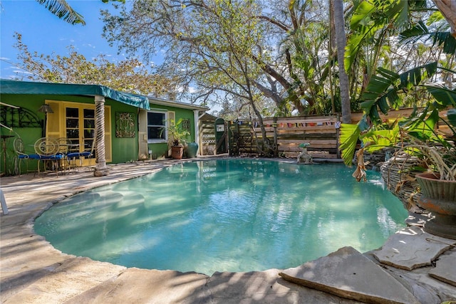 view of swimming pool featuring a patio area