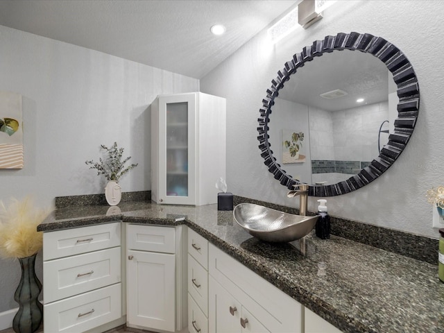 bathroom featuring vanity and a textured ceiling