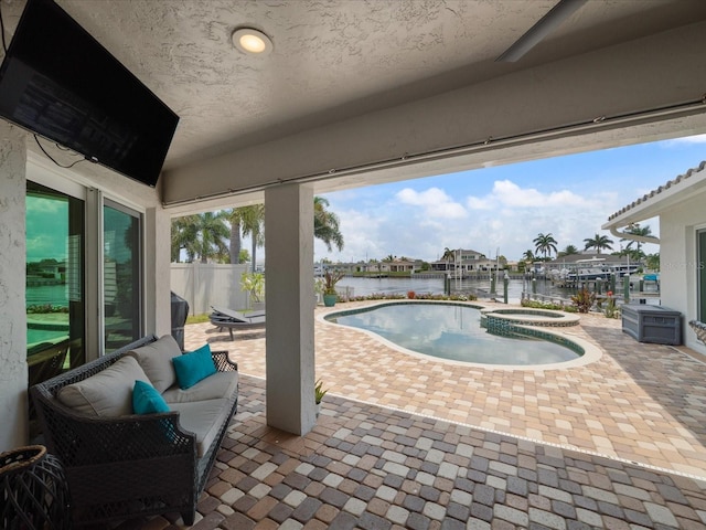 view of swimming pool with a water view, outdoor lounge area, an in ground hot tub, and a patio