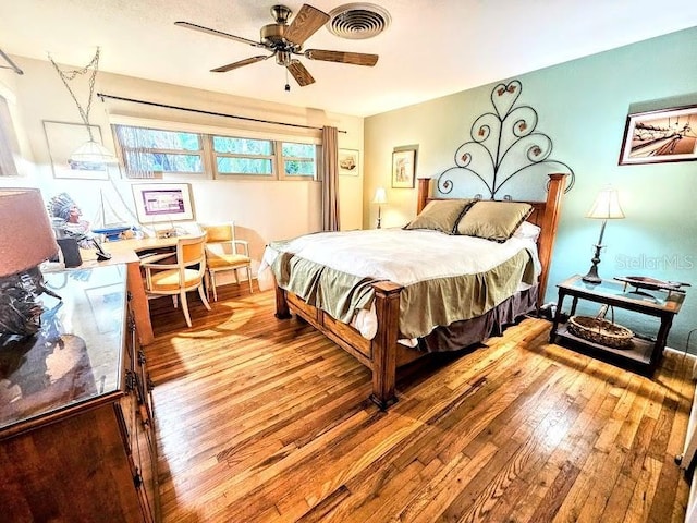 bedroom with wood-type flooring and ceiling fan