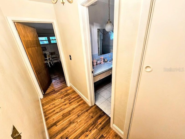 hall with dark hardwood / wood-style floors