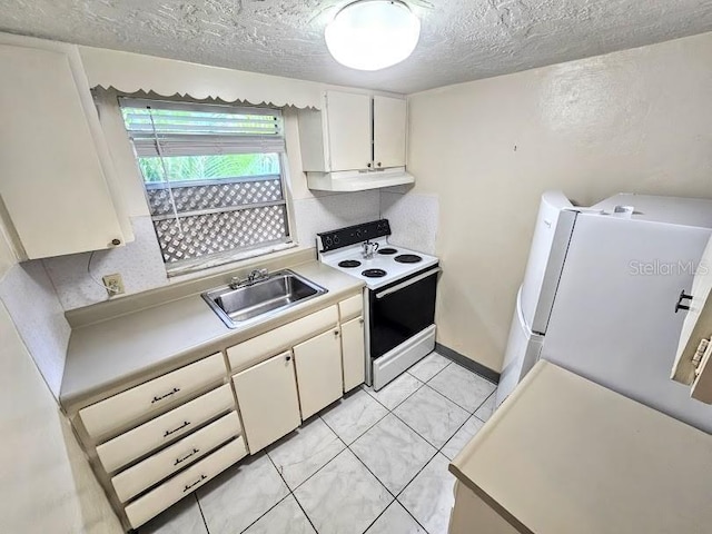 kitchen with sink, refrigerator, a textured ceiling, light tile patterned floors, and white electric stove