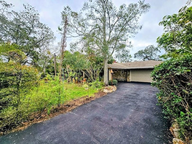 obstructed view of property featuring a garage