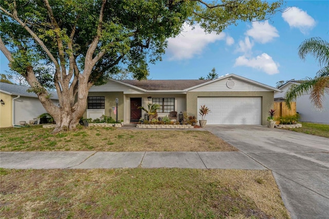 single story home featuring a garage and a front yard