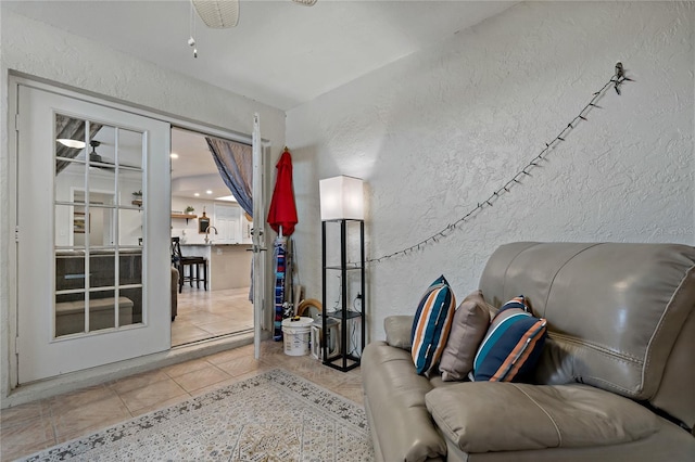 sitting room with sink and light tile patterned floors