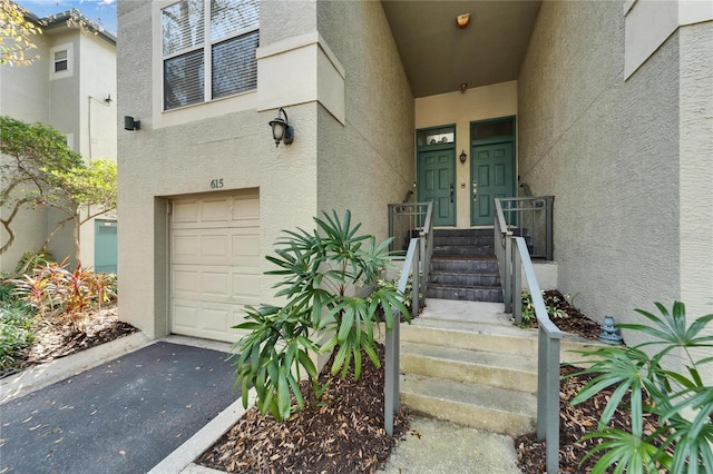 view of exterior entry featuring a garage