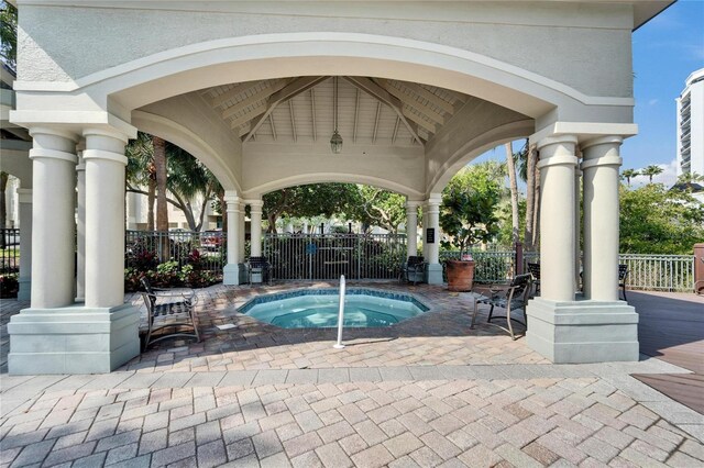 view of swimming pool with a gazebo, a hot tub, and a patio area