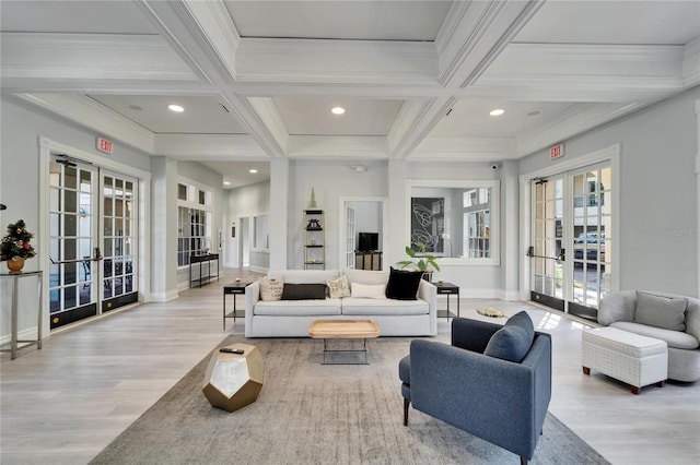 living room featuring french doors, coffered ceiling, crown molding, and beamed ceiling