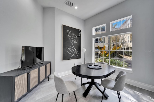 dining area with light hardwood / wood-style floors