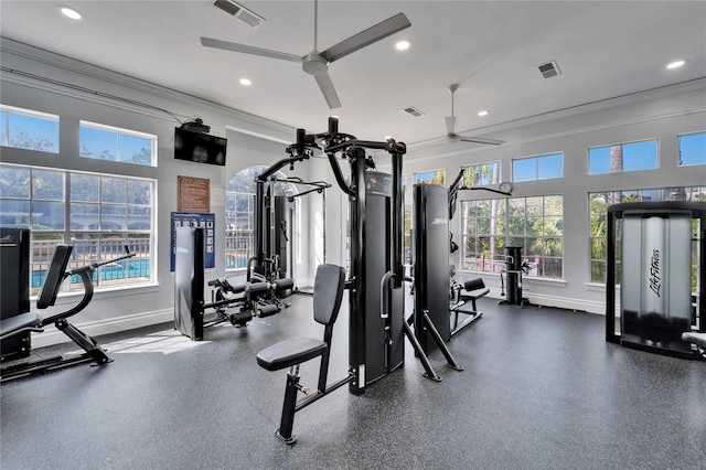 gym with crown molding and ceiling fan