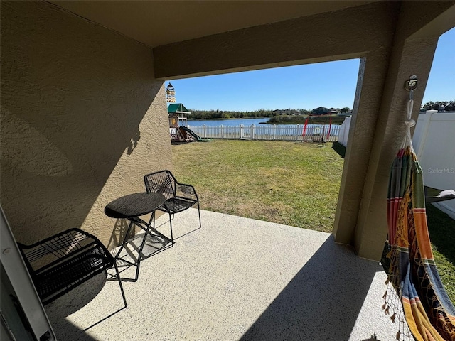 view of patio with a water view