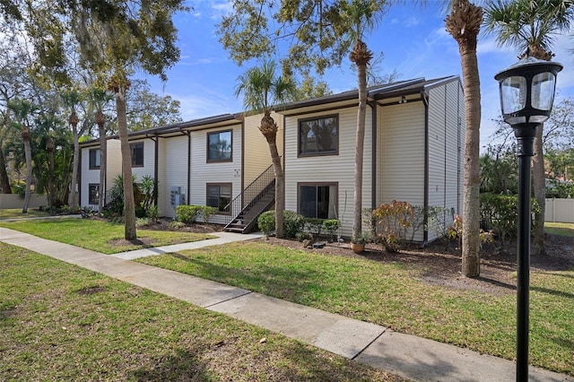 view of property with a front lawn