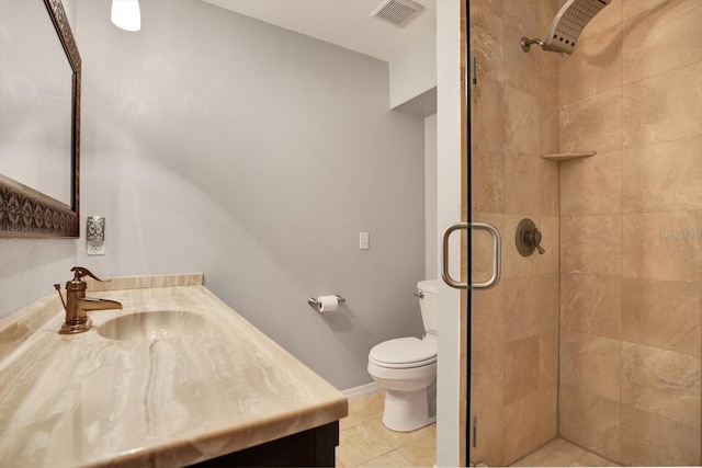 bathroom with vanity, toilet, and a shower with shower door