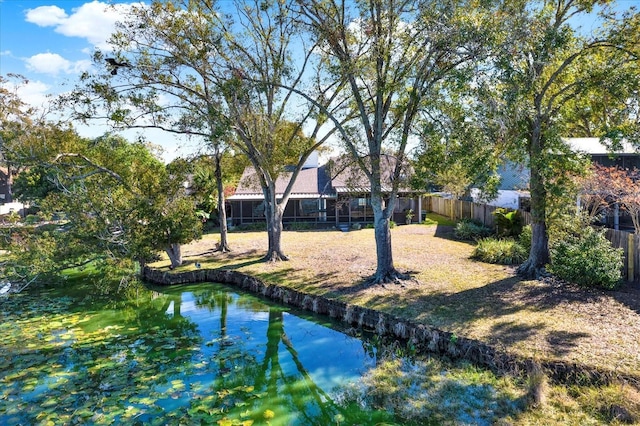 back of house with a water view