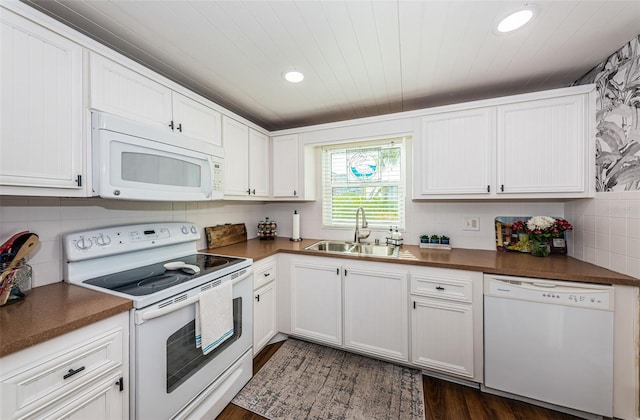 kitchen featuring sink, white cabinets, white appliances, and decorative backsplash