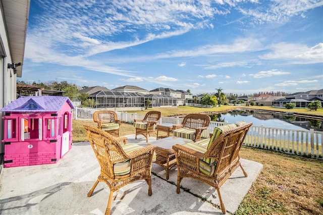 view of patio / terrace featuring outdoor lounge area and a water view