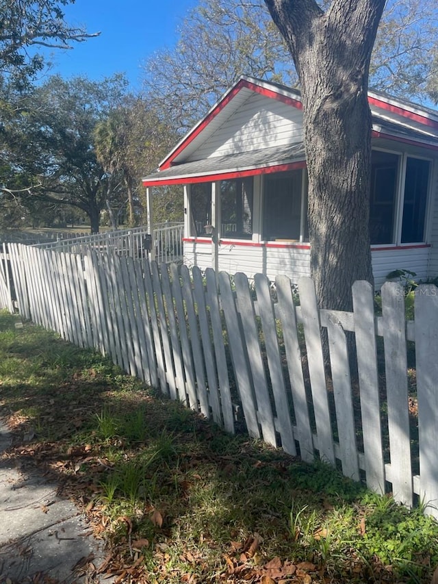 view of home's exterior featuring a sunroom