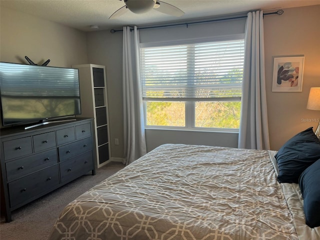 bedroom with light colored carpet and ceiling fan