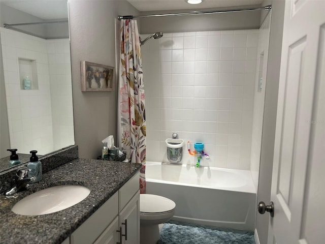 full bathroom featuring vanity, shower / tub combo with curtain, and toilet