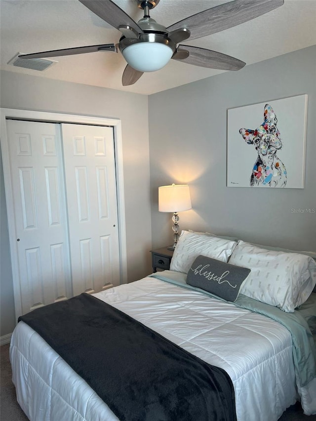 bedroom with carpet flooring, ceiling fan, and a closet