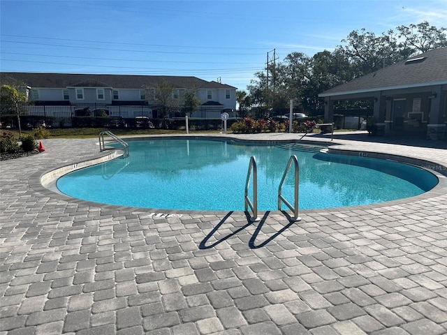 view of swimming pool featuring a patio area