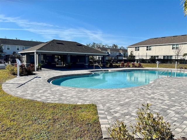 view of swimming pool with a patio area