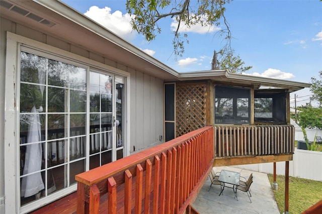 wooden deck with a patio