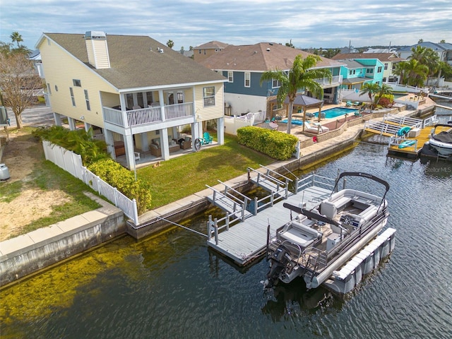 birds eye view of property with a water view