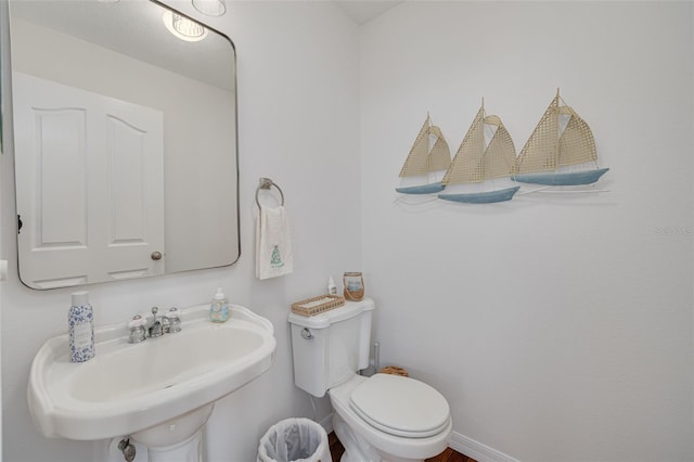 bathroom with sink and toilet