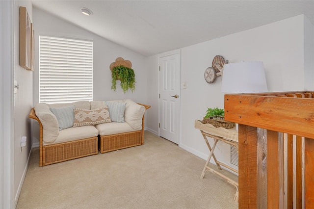 living area with vaulted ceiling and light carpet