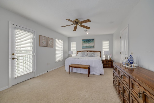 bedroom featuring light carpet, access to outside, and ceiling fan