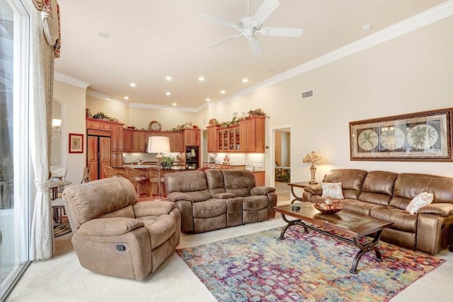 2867 Grey Oaks Blvd, Tarpon Springs, FL 34688 - living room featuring a high ceiling, ornamental molding, light colored carpet, and ceiling fan