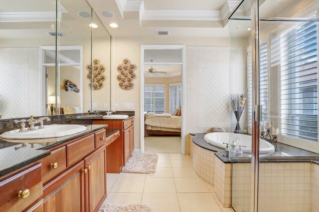 2867 Grey Oaks Blvd, Tarpon Springs, FL 34688 - bathroom with crown molding, vanity, tiled tub, ceiling fan, and tile patterned flooring