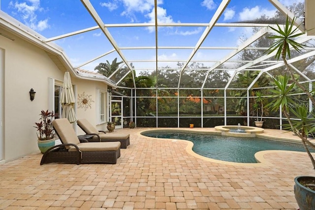 2867 Grey Oaks Blvd, Tarpon Springs, FL 34688 - view of pool with an in ground hot tub, glass enclosure, and a patio