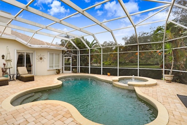2867 Grey Oaks Blvd, Tarpon Springs, FL 34688 - view of swimming pool featuring an in ground hot tub, a patio, and glass enclosure