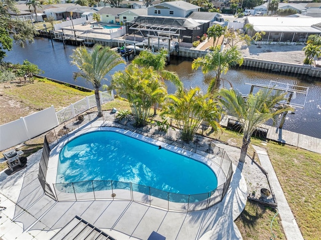 view of swimming pool with a water view