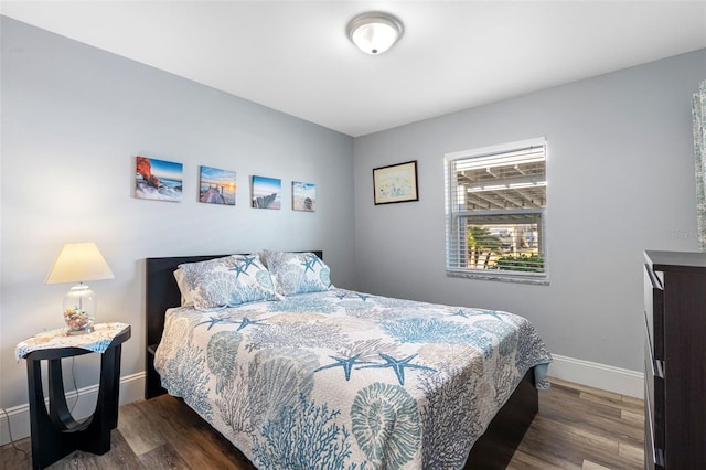 bedroom featuring dark wood-type flooring