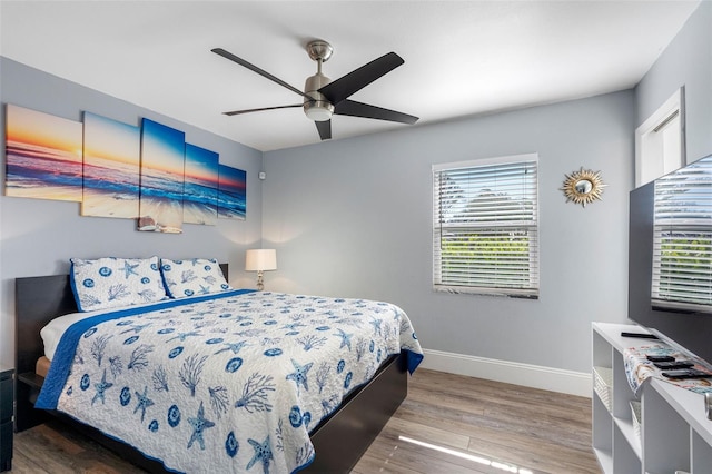 bedroom featuring wood-type flooring and ceiling fan