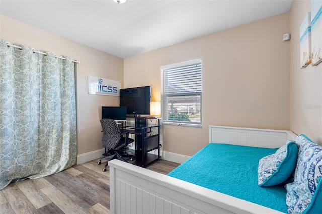 bedroom featuring hardwood / wood-style flooring