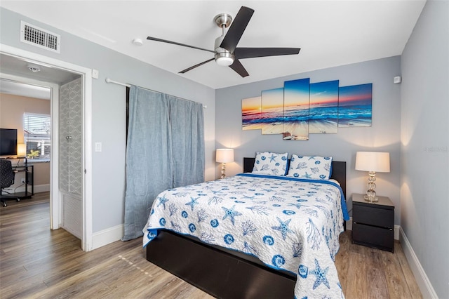 bedroom featuring hardwood / wood-style flooring and ceiling fan