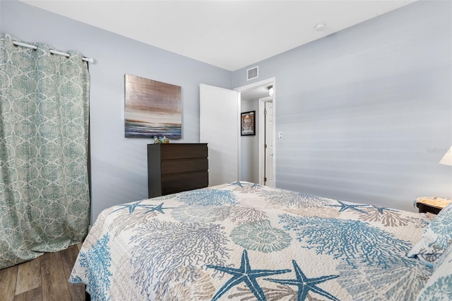 bedroom featuring dark hardwood / wood-style flooring