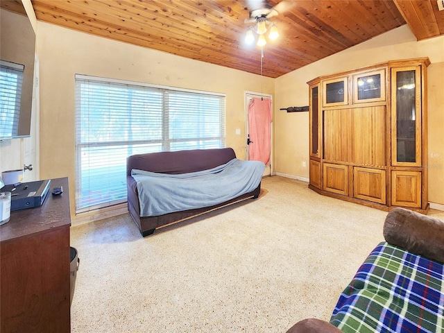 bedroom with lofted ceiling, multiple windows, baseboards, and wood ceiling
