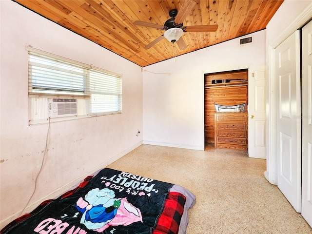 unfurnished bedroom featuring cooling unit, speckled floor, vaulted ceiling, visible vents, and wooden ceiling
