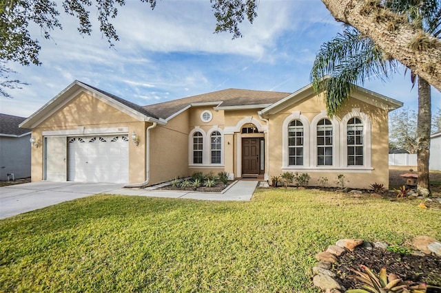 view of front of house featuring a garage and a front lawn