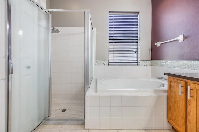 bathroom featuring vanity, tile patterned floors, and independent shower and bath