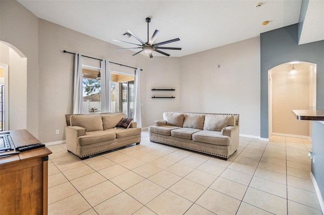 living room featuring ceiling fan and light tile patterned flooring