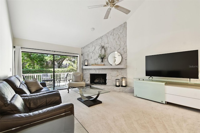 carpeted living room featuring a fireplace, high vaulted ceiling, and ceiling fan