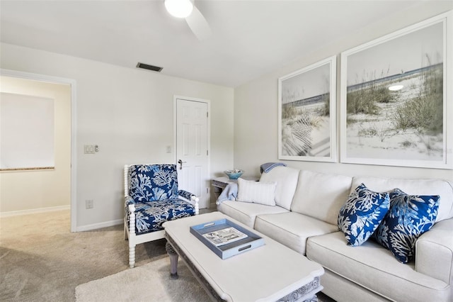 living room featuring carpet floors and ceiling fan